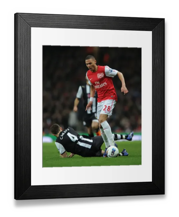 Framed Print : Arsenal's Kieran Gibbs Outmaneuvers Newcastle's Yohan Cabaye during the 2011-12 Premier League Match