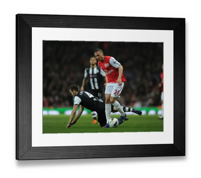 Framed Print : Arsenal's Kieran Gibbs Outwits Yohan Cabaye: A Flawless Moment of Skill from the 2011-12 Premier League Match