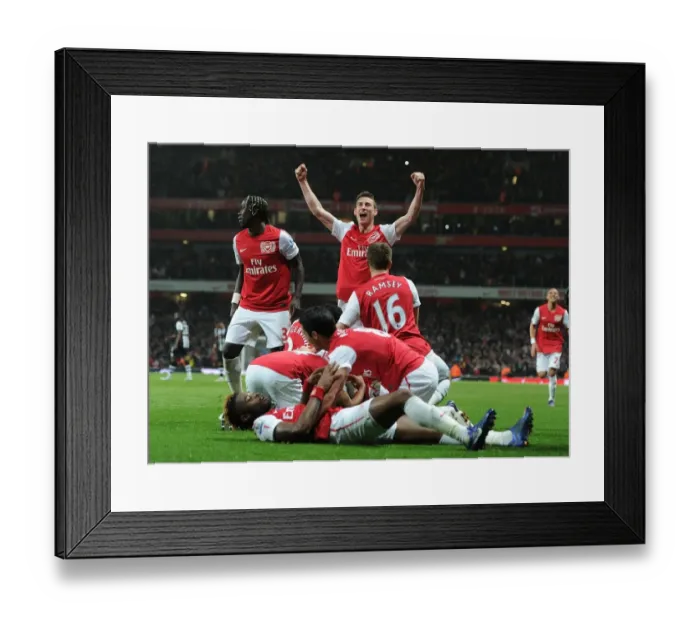 Framed Print : Celebrating the Second Goal: Arsenal's Victory Moment against Newcastle United (2011-12)