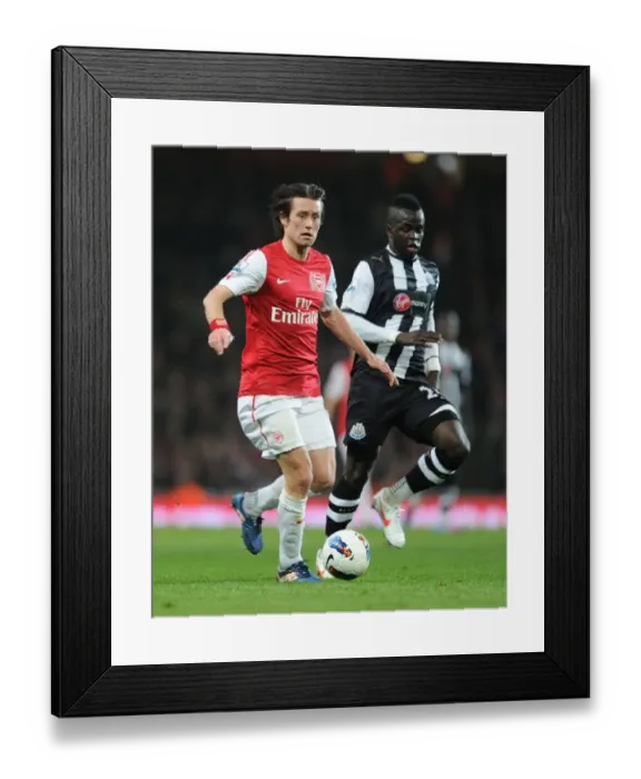 Framed Print : Arsenal's Rosicky Outmaneuvers Newcastle's Tiote in Premier League Clash (2011-12)