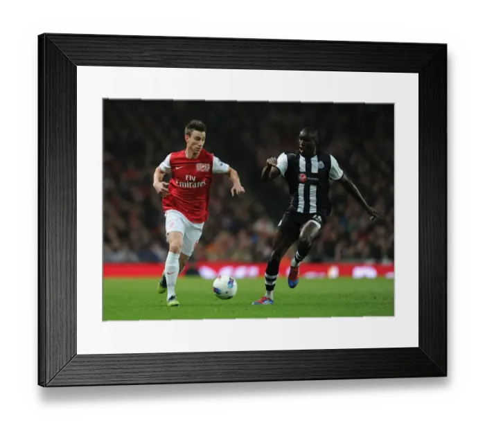 Framed Print : Arsenal's Koscielny Outmaneuvers Newcastle's Ba in Premier League Clash Framed Print : Arsenal's Koscielny Outmaneuvers Newcastle's Ba in Premier League Clash