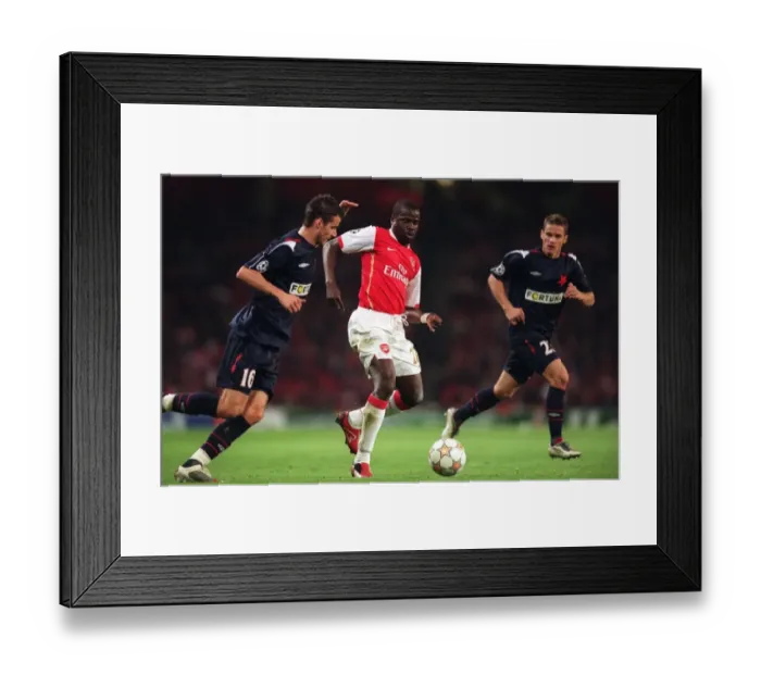 Framed Print : Arsenal's Dominant 7-0 Victory over Slavia Prague: Eboue's Double Strike with Daniel Pudil Framed Print : Arsenal's Dominant 7-0 Victory over Slavia Prague: Eboue's Double Strike with Daniel Pudil