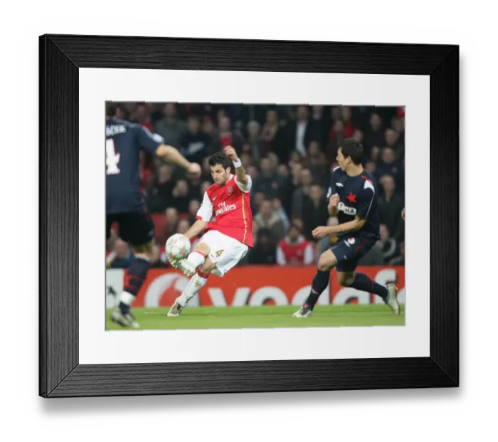 Framed Print : Cesc Fabregas's Historic First Goal: Arsenal Crushes Slavia Prague 7-0 in Champions League