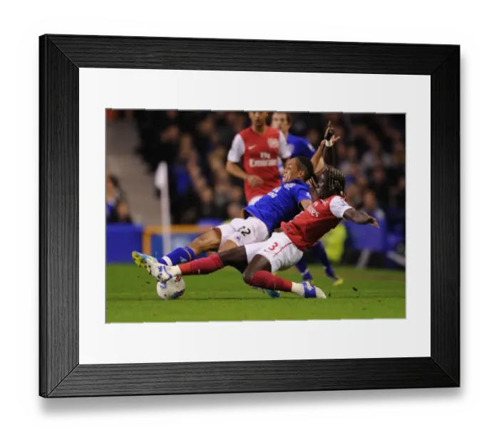 Framed Print : Sagna Stops Pienaar: Intense Battle at Goodison Park - Everton vs Arsenal, Premier League 2011-12 Framed Print : Sagna Stops Pienaar: Intense Battle at Goodison Park - Everton vs Arsenal, Premier League 2011-12
