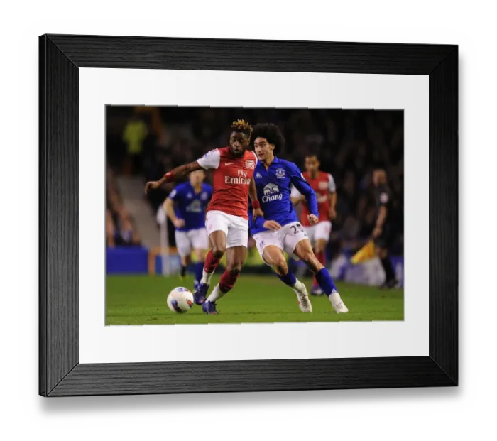 Framed Print : Alex Song Outmaneuvers Marouane Fellaini: Everton vs. Arsenal, Premier League Clash (2011-2012) Framed Print : Alex Song Outmaneuvers Marouane Fellaini: Everton vs. Arsenal, Premier League Clash (2011-2012)