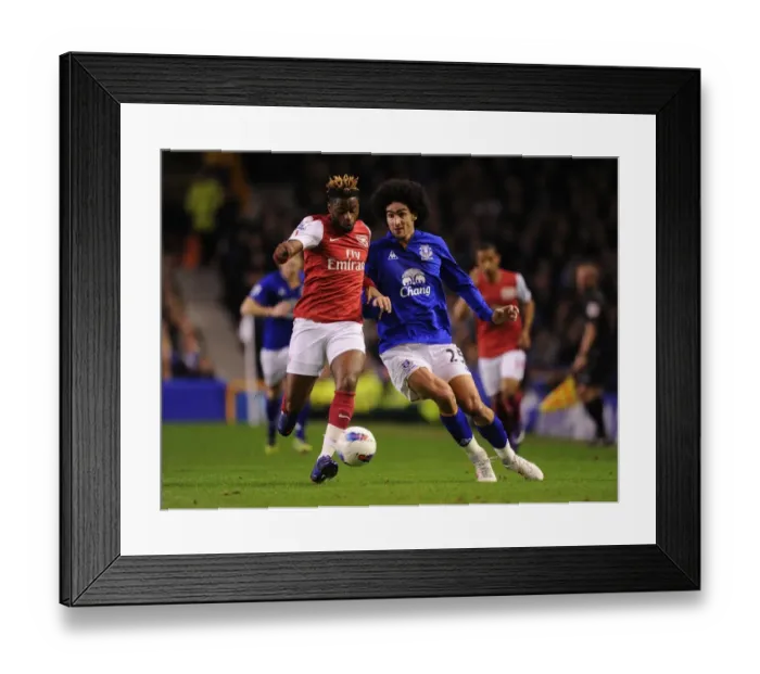 Framed Print : Clash of Midfield Titans: Alex Song vs. Marouane Fellaini (Everton v Arsenal, 2012) Framed Print : Clash of Midfield Titans: Alex Song vs. Marouane Fellaini (Everton v Arsenal, 2012)