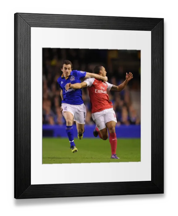 Framed Print : Theo Walcott vs Leighton Baines: Intense Rivalry at Goodison Park (Everton vs Arsenal, Premier League, 2011-12) Framed Print : Theo Walcott vs Leighton Baines: Intense Rivalry at Goodison Park (Everton vs Arsenal, Premier League, 2011-12)