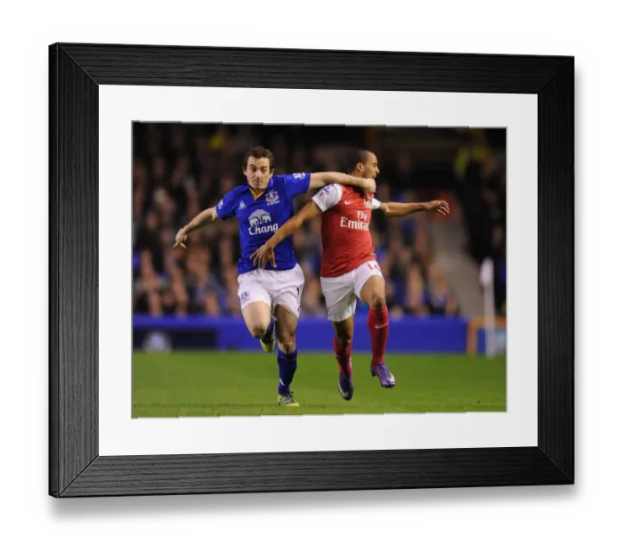 Framed Print : Theo Walcott vs Leighton Baines: A Premier League Rivalry Ignites at Goodison Park (2011-12) Framed Print : Theo Walcott vs Leighton Baines: A Premier League Rivalry Ignites at Goodison Park (2011-12)