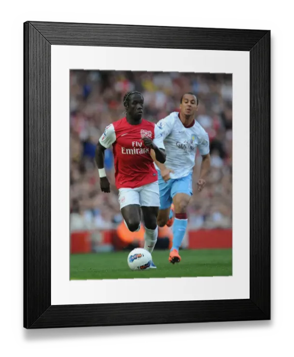 Framed Print : Battling Past Agbonlahor: Sagna's Determined Run at Arsenal vs Aston Villa (2011-12)