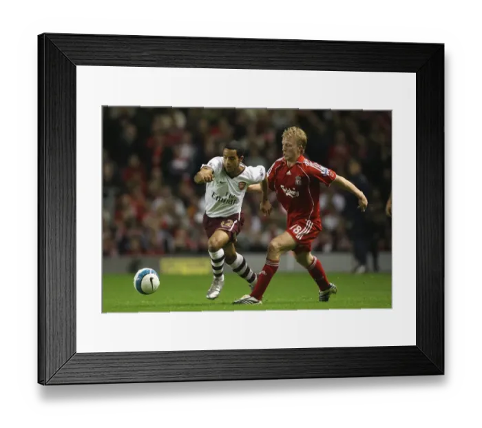 Framed Print : The Battle of Anfield: Walcott vs. Kuyt - A Premier League Rivalry Ends in a 1:1 Stalemate