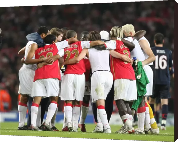 Arsenal players form a huddle at the end of the match