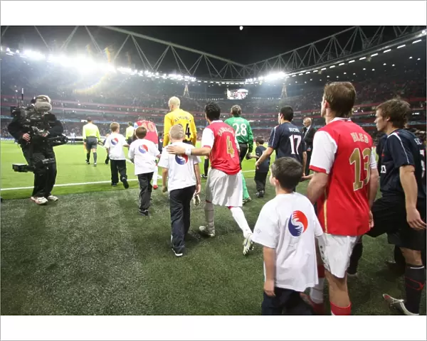 Cesc Fabregas and Alex Hleb (Arsenal) walk out before the match
