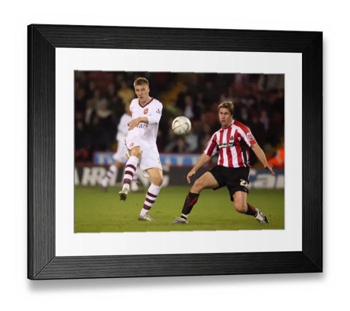 Framed Print : Nicklas Bendtner (Arsenal) Chris Lucketti (Sheff) Framed Print : Nicklas Bendtner (Arsenal) Chris Lucketti (Sheff)
