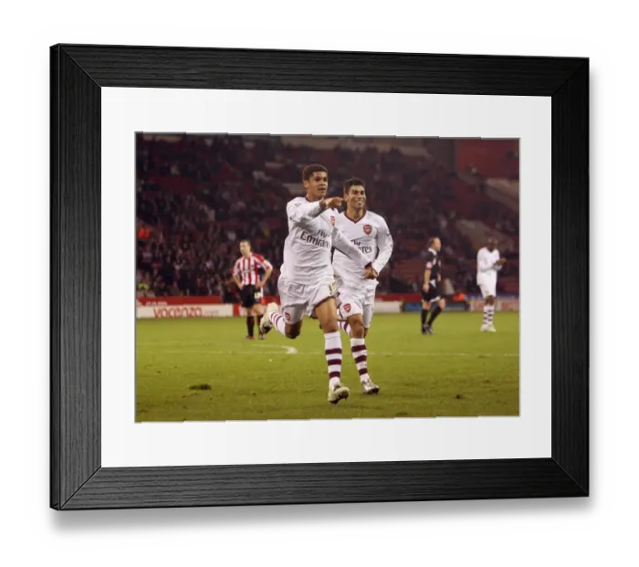 Framed Print : Denilson and Eduardo: Arsenal's Triumphant Moment after Scoring the Third Goal against Sheffield United in the Carling Cup Framed Print : Denilson and Eduardo: Arsenal's Triumphant Moment after Scoring the Third Goal against Sheffield United in the Carling Cup