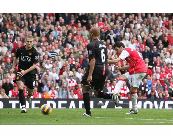 Cesc Fabregas shoots past Edwin van der Sar to score the 1st Arsenal goal