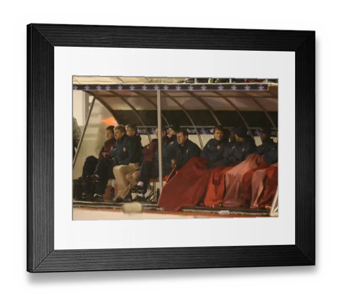 Framed Print : The Arsenal bench during the match
