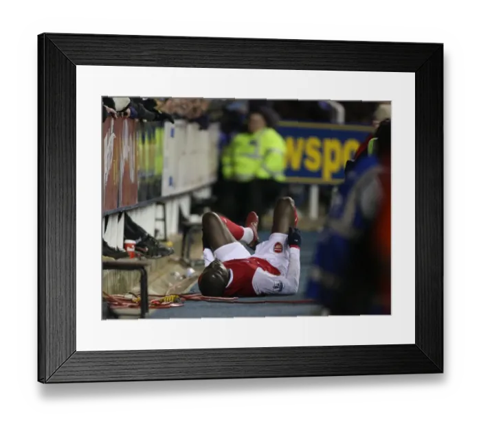 Framed Print : Injured Arsenal midfielder Emmanuel Eboue