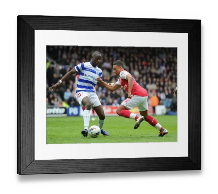 Framed Print : Arsenal's Oxlade-Chamberlain Faces Off Against QPR's Diakite (2011-12)