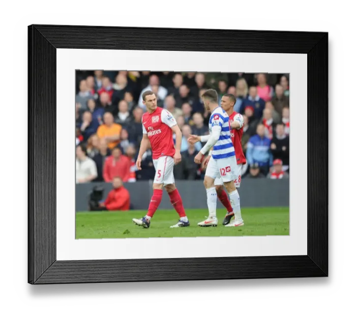 Framed Print : Clash at Loftus Road: Vermaelen vs. Mackie in the Premier League Battle between Queens Park Rangers and Arsenal