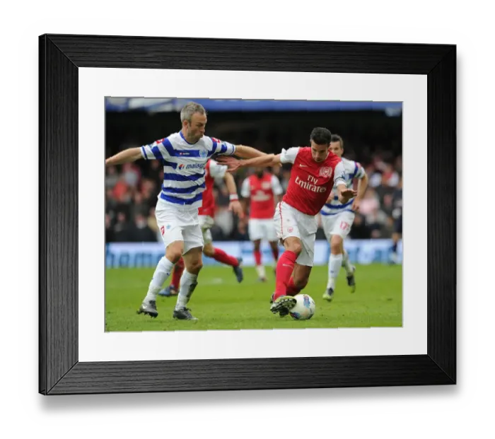 Framed Print : Robin van Persie vs. Shaun Derry: A Battle in the Premier League between Queens Park Rangers and Arsenal Framed Print : Robin van Persie vs. Shaun Derry: A Battle in the Premier League between Queens Park Rangers and Arsenal