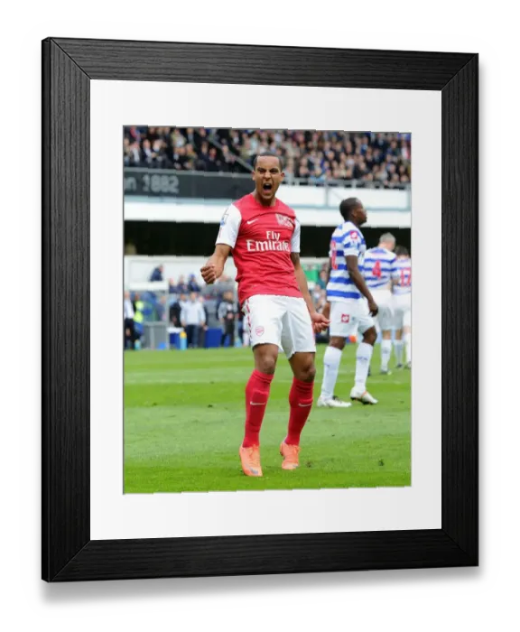 Framed Print : Theo Walcott's Thrilling Goal Celebration: Arsenal's Triumph at Queens Park Rangers, Premier League 2011-12