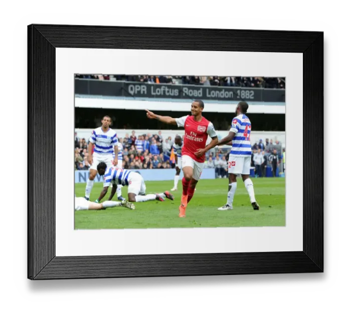 Framed Print : Theo Walcott's Thrilling Goal Celebration: Arsenal's Triumph at Queens Park Rangers, Premier League 2011-12