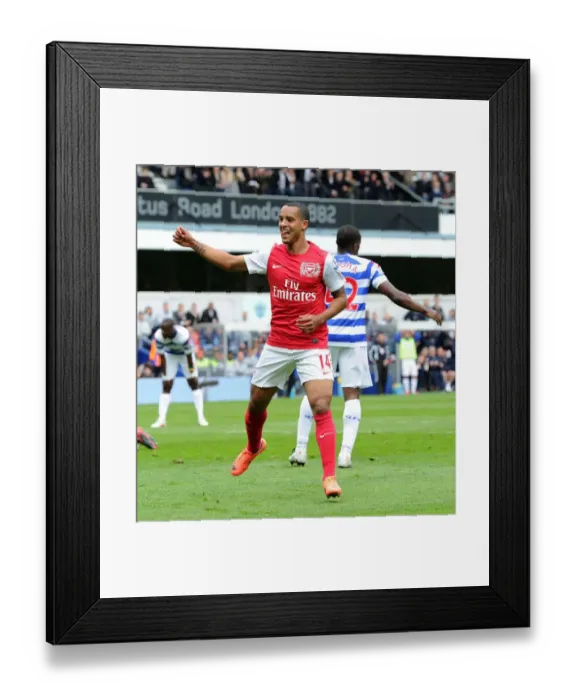 Framed Print : Theo Walcott's Euphoric Goal Celebration: Arsenal's Triumph at Queens Park Rangers, Premier League 2011-12