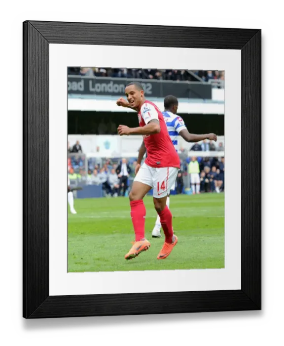 Framed Print : Theo Walcott's Thrilling Goal Celebration: Arsenal's Triumph at Queens Park Rangers, Premier League 2011-12