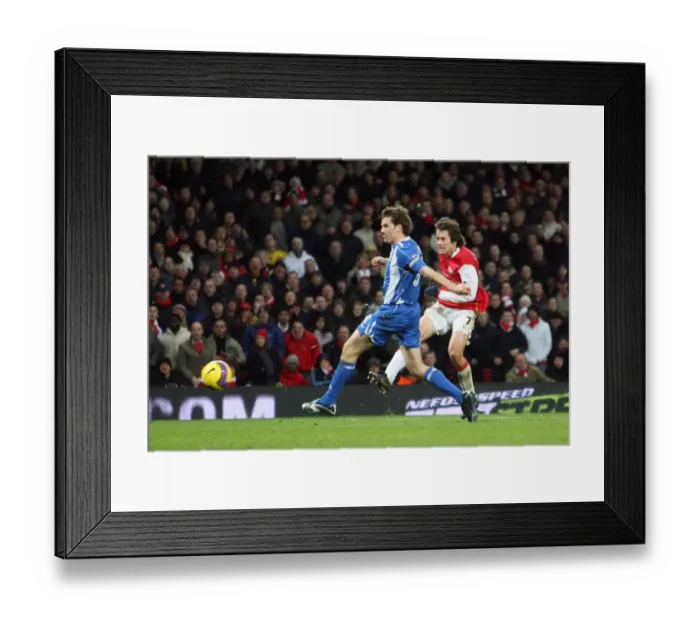 Framed Print : Tomas Rosicky scores Arsenals 2nd goal past Kevin Kilbane (Wigan)