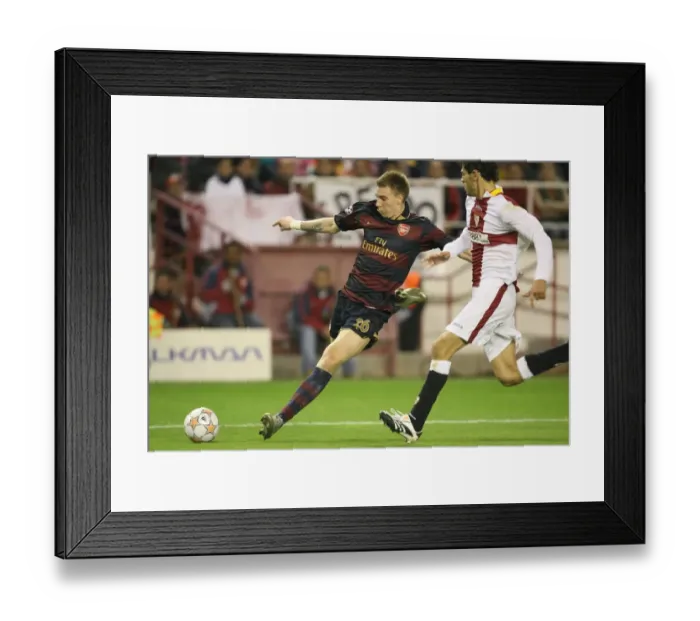 Framed Print : Nicklas Bendtner (Arsenal) Federico Fazio (Seville) Framed Print : Nicklas Bendtner (Arsenal) Federico Fazio (Seville)