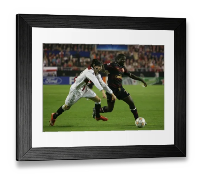 Framed Print : Eboue vs. Crespo: Seville's Champions League Showdown - Arsenal's Eboue Takes on Seville's Crespo Framed Print : Eboue vs. Crespo: Seville's Champions League Showdown - Arsenal's Eboue Takes on Seville's Crespo
