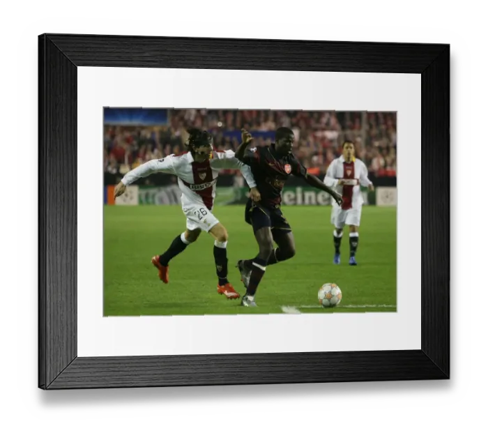 Framed Print : Emmanuel Eboue (Arsenal) Jose Angel Crespo (Seville)