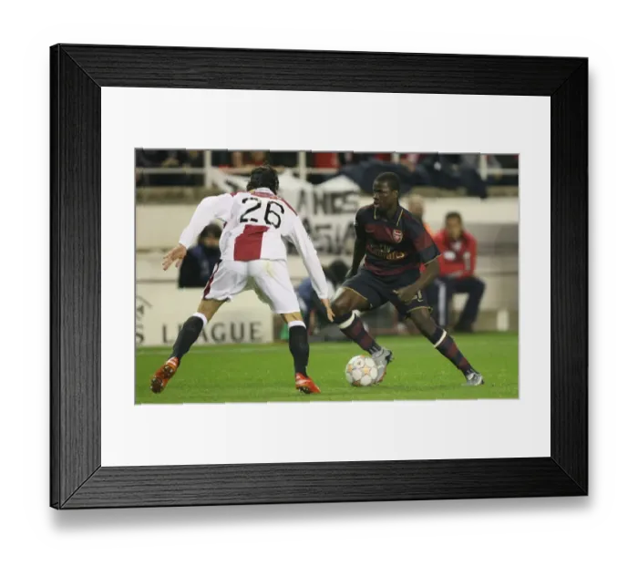 Framed Print : Champions League Showdown: Eboue vs. Crespo - Arsenal's Battle at Seville's Ramon Sanchez-Pizjuan Stadium Framed Print : Champions League Showdown: Eboue vs. Crespo - Arsenal's Battle at Seville's Ramon Sanchez-Pizjuan Stadium