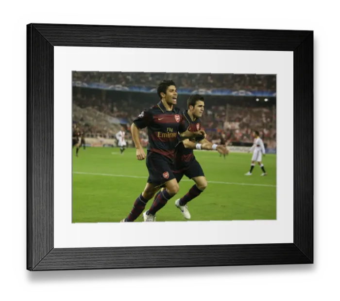 Framed Print : Arsenal's Unforgettable Triumph: Eduardo and Fabregas's Goal Celebration in Seville, UEFA Champions League (3:1)