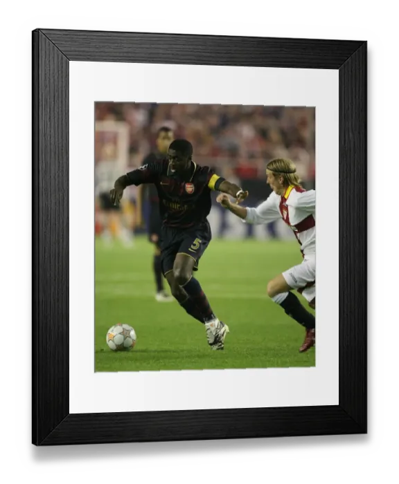 Framed Print : Kolo Toure (Arsenal) Christian Poulsen (Seville) Framed Print : Kolo Toure (Arsenal) Christian Poulsen (Seville)