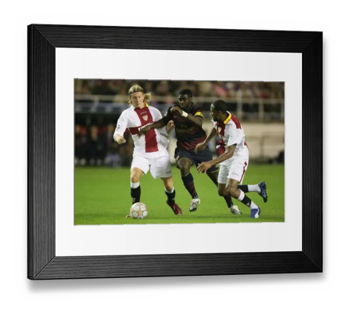 Framed Print : Champions Clash: Kolo Toure, Seydou Keita, and Christian Poulsen in Seville's 3-1 Victory over Arsenal, UEFA Champions League, Group H
