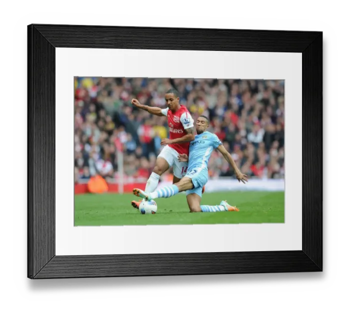 Framed Print : Theo Walcott's Electrifying Run: Arsenal vs Manchester City, Premier League 2011-12 - A Highlight of Skill and Speed Framed Print : Theo Walcott's Electrifying Run: Arsenal vs Manchester City, Premier League 2011-12 - A Highlight of Skill and Speed