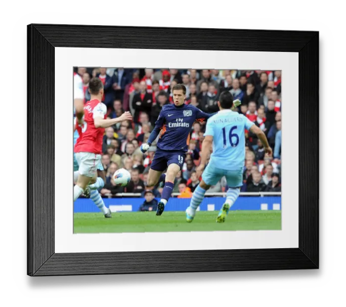 Framed Print : Wojciech Szczesny (Arsenal) clears the ball away from Sergio Aguero (Man City) Framed Print : Wojciech Szczesny (Arsenal) clears the ball away from Sergio Aguero (Man City)