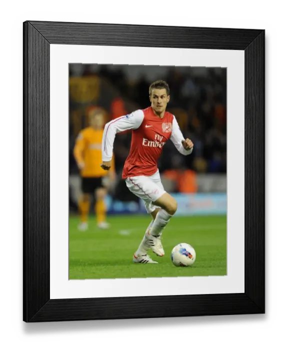 Framed Print : Aaron Ramsey (Arsenal). Wolverhampton Wanderers 0: 3 Arsenal. Barclays Premier League
