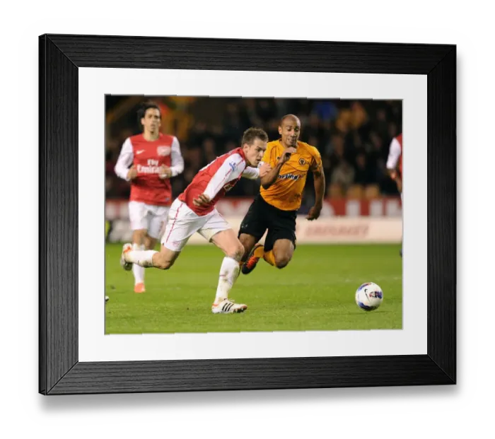 Framed Print : Aaron Ramsey Dashes Past Carl Henry: Intense Moment from Wolverhampton Wanderers vs. Arsenal (2011-12)