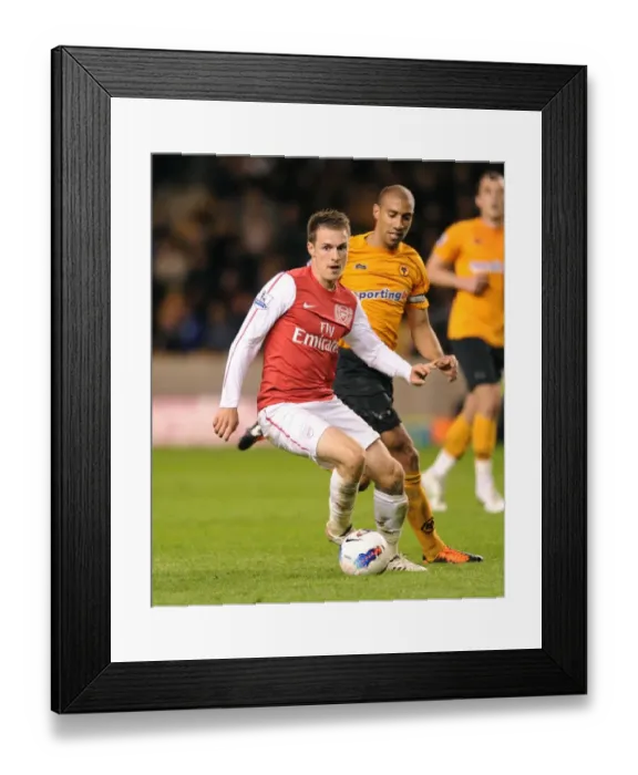 Framed Print : Ramsey Surges Past Henry: Arsenal's Midfield Masterclass vs. Wolverhampton Wanderers, Premier League 2011-12 Framed Print : Ramsey Surges Past Henry: Arsenal's Midfield Masterclass vs. Wolverhampton Wanderers, Premier League 2011-12