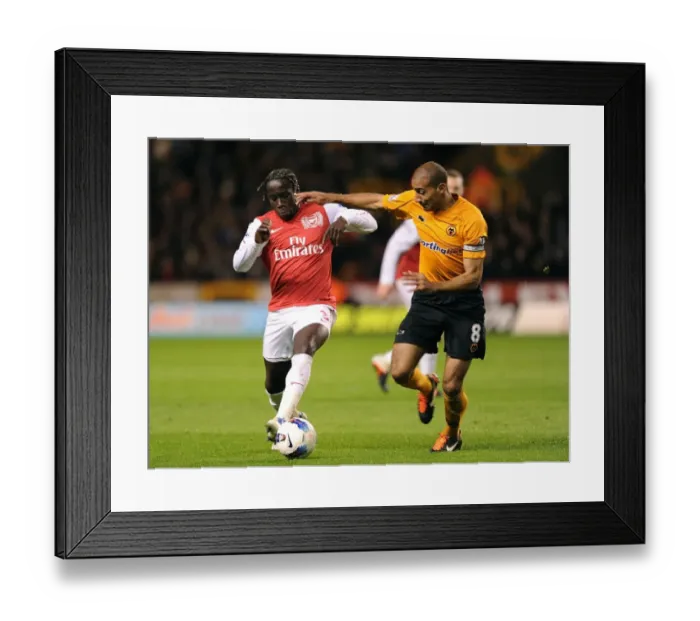 Framed Print : Bacary Sagna Outsmarts Carl Henry: A Premier League Battle at Molineux, 2012 Framed Print : Bacary Sagna Outsmarts Carl Henry: A Premier League Battle at Molineux, 2012