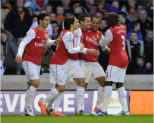 Robin van Persie celebrates scoring Arsenals 1st goal with his team mates