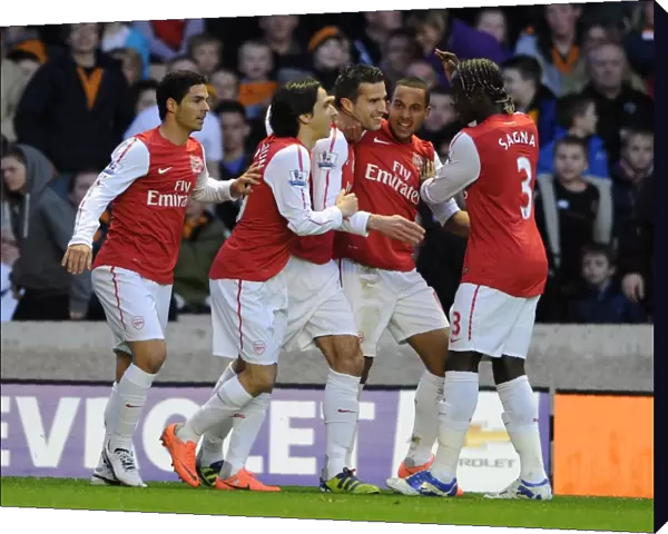 Robin van Persie celebrates scoring Arsenals 1st goal with his team mates