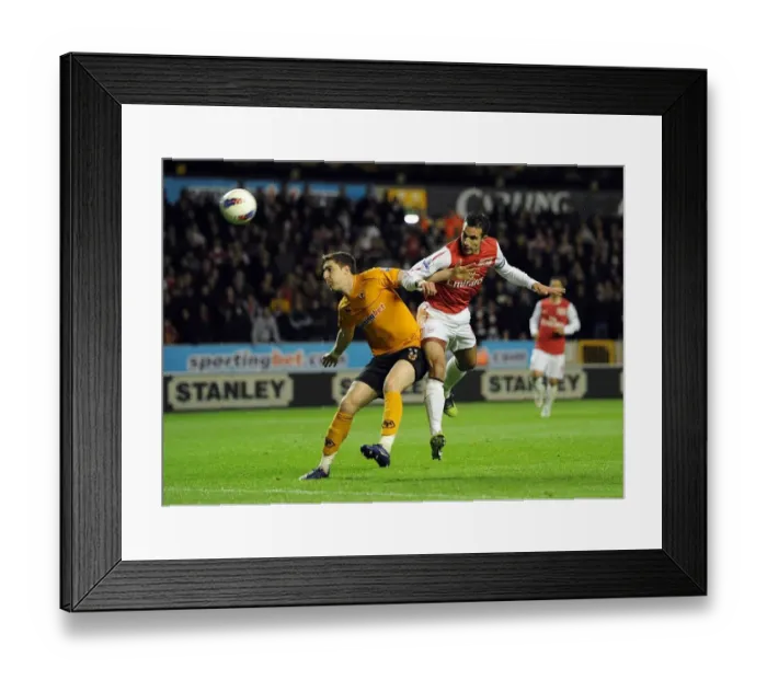 Framed Print : Robin van Persie vs. Stephen Ward: Intense Heading Duel in Arsenal's Premier League Clash with Wolverhampton Wanderers