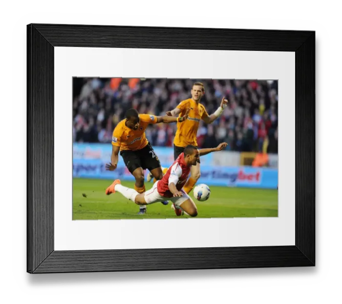 Framed Print : Theo Walcott vs Sebastien Bassong: Penalty Drama in Wolverhampton Wanderers vs Arsenal (2011-12)