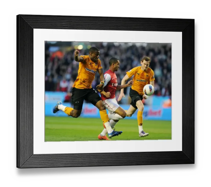 Framed Print : Dramatic Penalty Showdown: Theo Walcott vs Sebastien Bassong at Wolverhampton Wanderers (2011-12) Framed Print : Dramatic Penalty Showdown: Theo Walcott vs Sebastien Bassong at Wolverhampton Wanderers (2011-12)