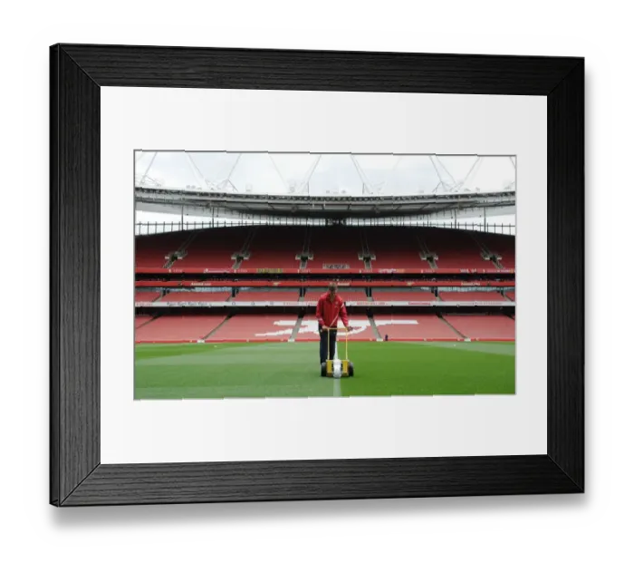 Framed Print : Arsenal Groundsman Prepares Emirates Stadium Pitch for Wigan Athletic Clash (2011-12) Framed Print : Arsenal Groundsman Prepares Emirates Stadium Pitch for Wigan Athletic Clash (2011-12)