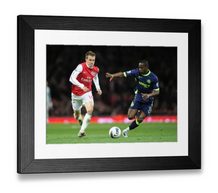 Framed Print : Arsenal's Aaron Ramsey Outmaneuvers Wigan's Maynor Figueroa