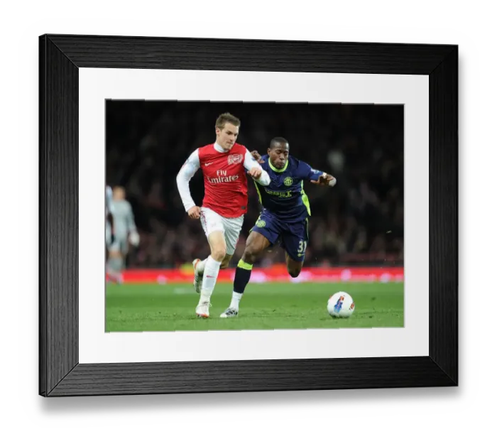 Framed Print : Aaron Ramsey Outsmarts Maynor Figueroa: Arsenal's Masterclass in the 2012 Match against Wigan Framed Print : Aaron Ramsey Outsmarts Maynor Figueroa: Arsenal's Masterclass in the 2012 Match against Wigan